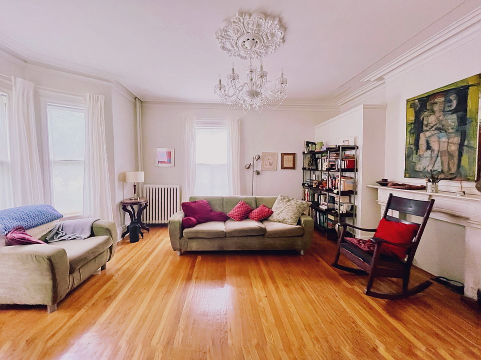 The current tenants use the front room as their living room.
