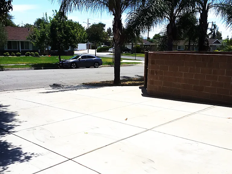 BIG driveway where you can park at least 4 more cars, in addition to the garage that holds two cars.
