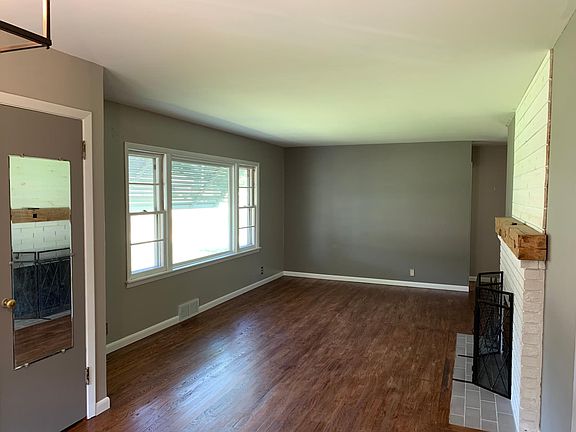 Open living room with gas log fireplace