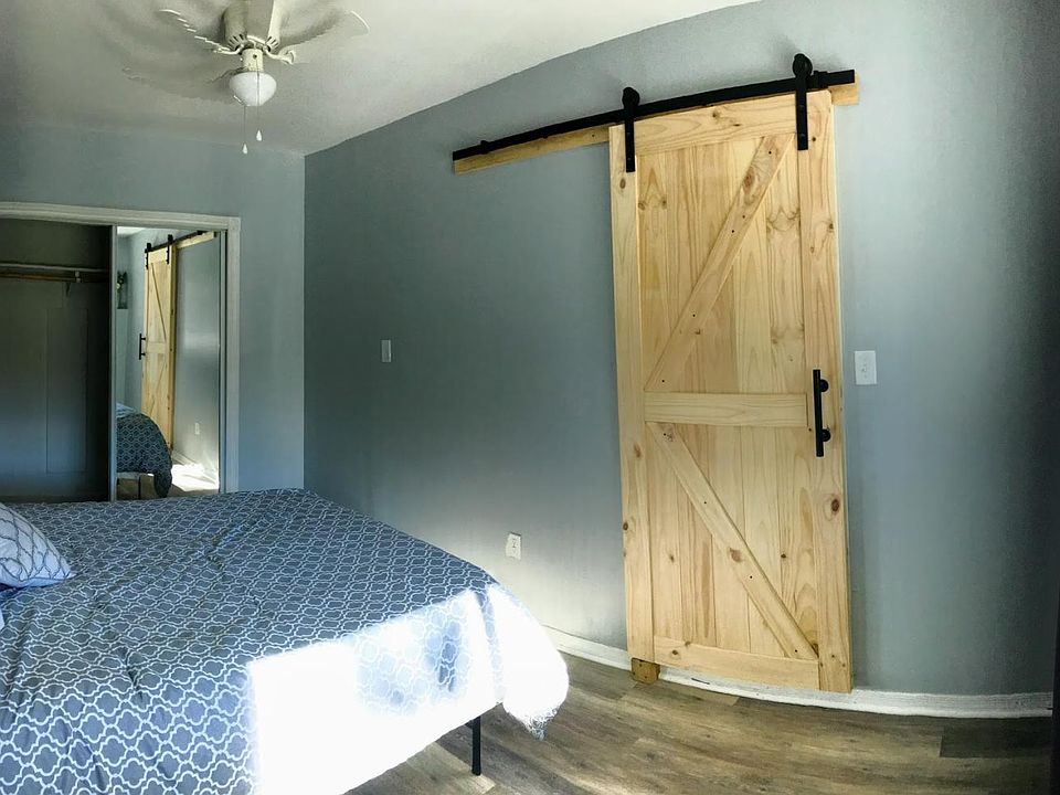 Custom sliding barn door and newly painted master bedroom.