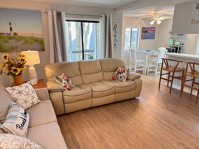 Living room, Eating area, kitchen counter and sliding door to screened in patio