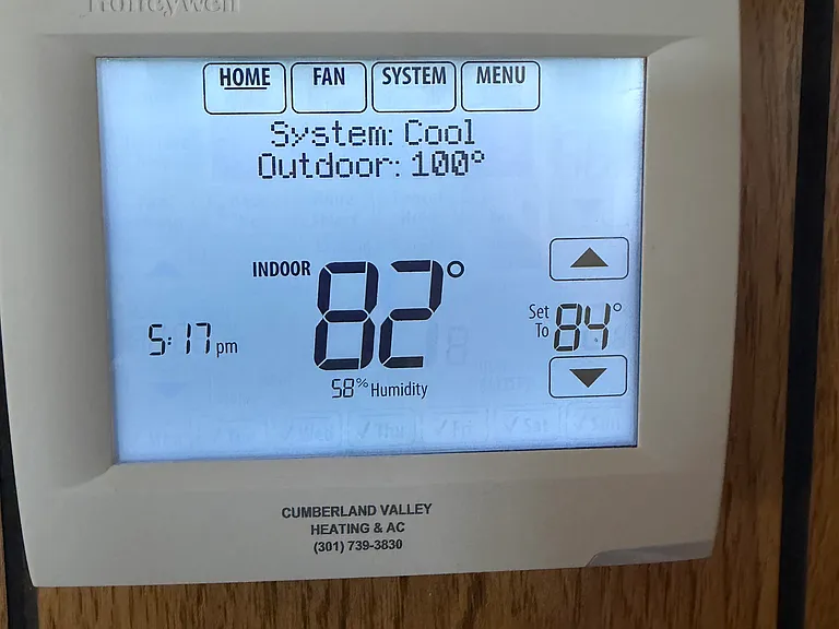 Centrally controlled heat and air-conditioning, control panel located in living room.