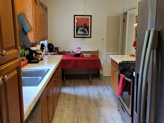 Kitchen with (newish) appliances. Beautiful canyon view out window, 2nd bathroom to the right of washer.