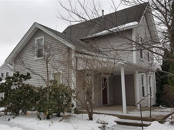 View from side yard (North) and unfinished driveway.