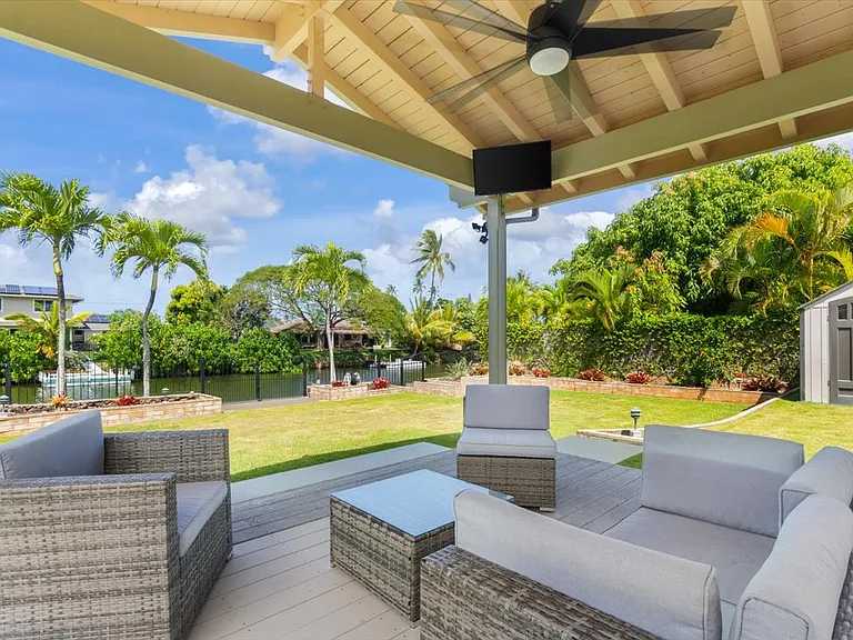 Relaxing covered Lanai/Pavilion looking out onto the canal, boat launch and fishing doc.
