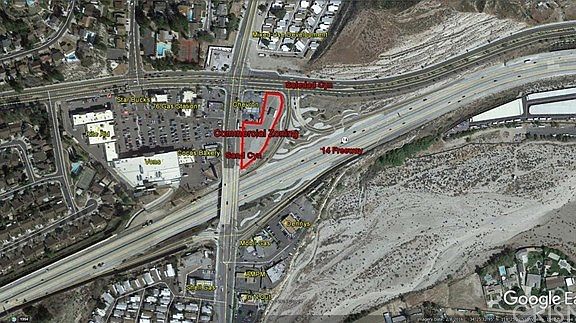 Multiple freeway on and off ramps surround propert