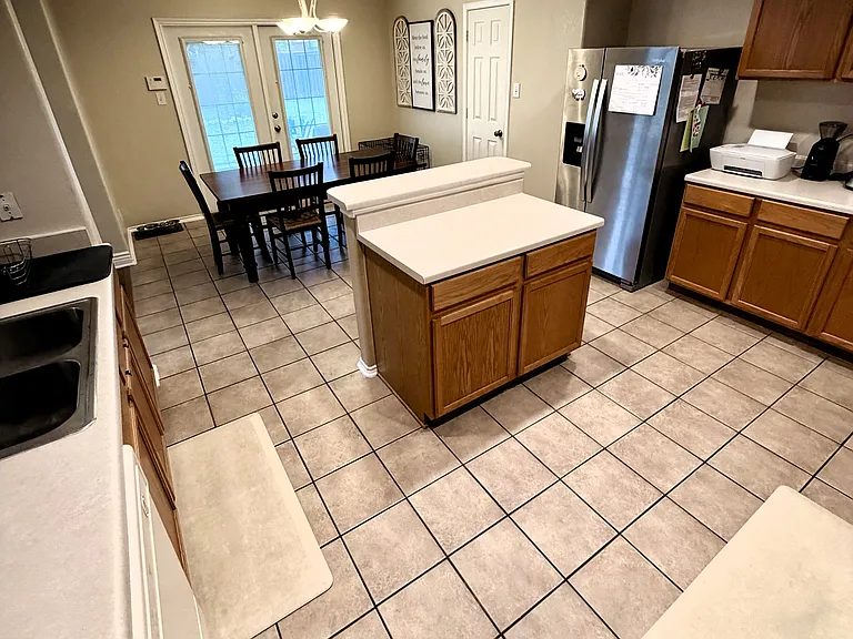 Kitchen with expansive cabinets and countertops