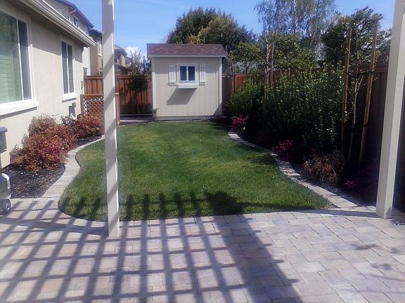 Backyard patio and yard.