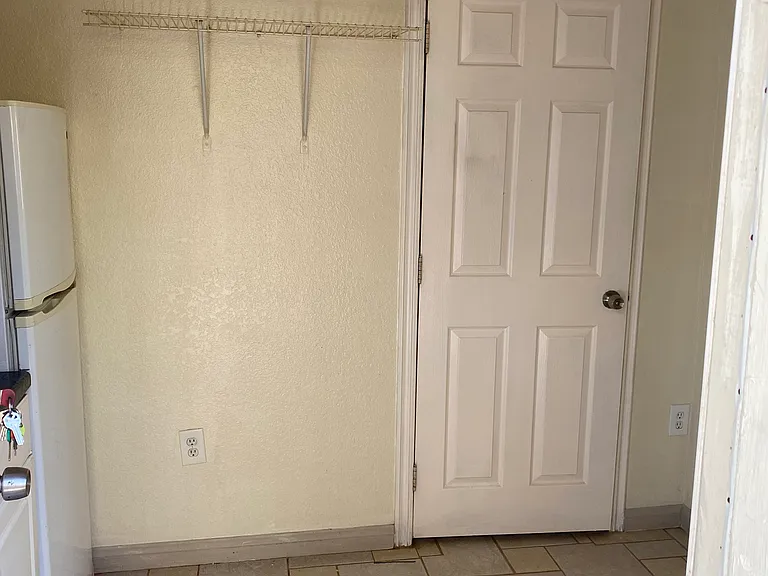 door to bathroom from kitchenet area.