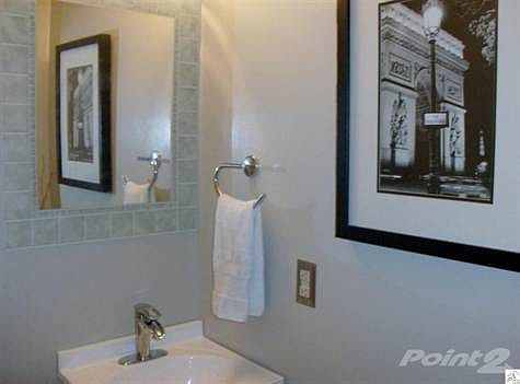 NEW vanity, Fawcett, lights, mirror, paint & floor! Located on the main level