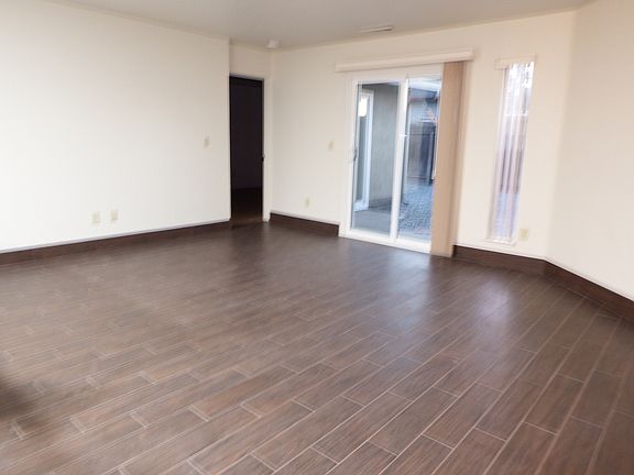 Livingroom with patio door to private backyard