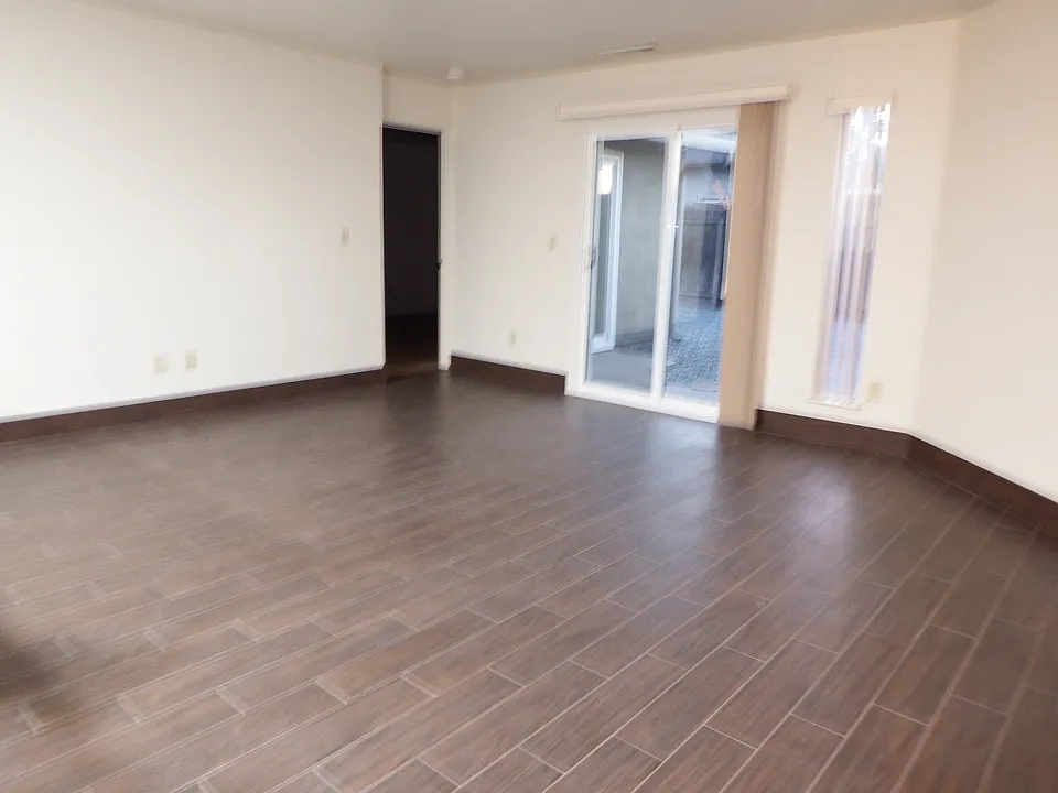 Livingroom with patio door to private backyard
