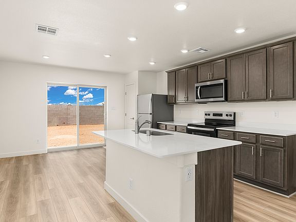 A spacious kitchen island makes meal preperation easy.