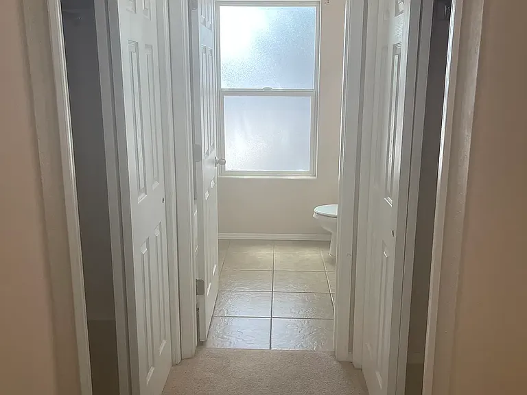 Master bedroom closets and entry into bathrom