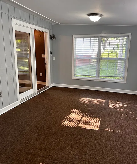 Family room showing double doors into open kitchen