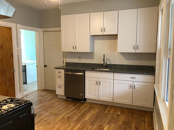 Kitchen with new energy efficient dishwasher & granite countertops