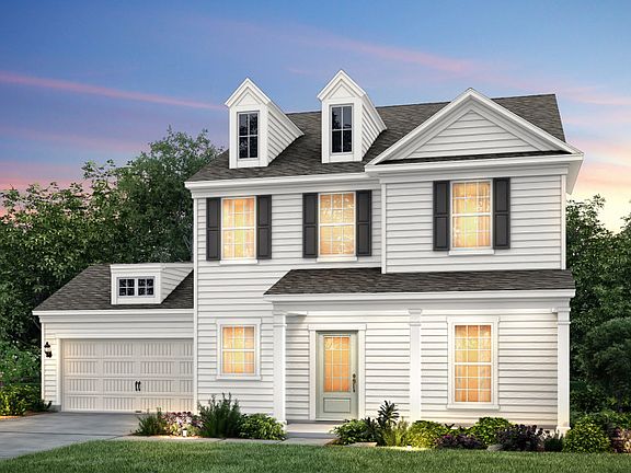 Foxfield Exterior 2 w siding, front sitting porch and 2 car garage