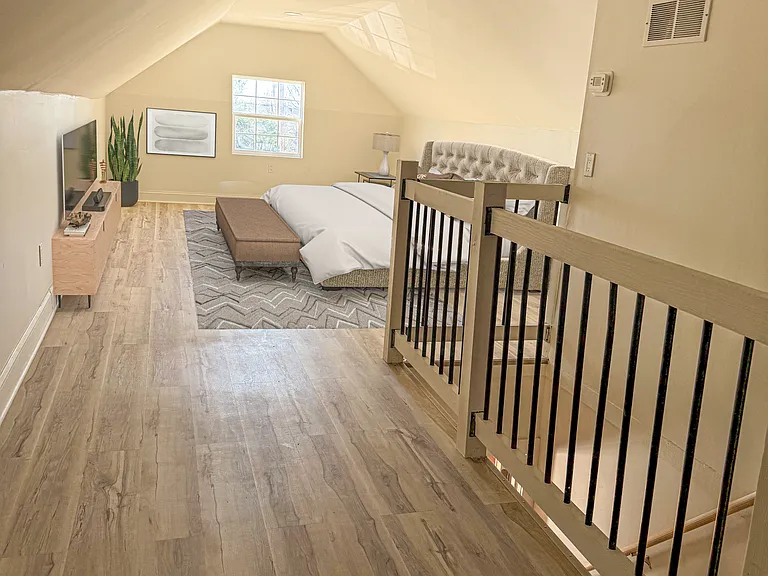 Digitally staged upstairs bedroom