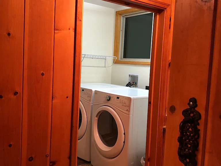the laundry room has nice a very nice washer and dryer and storage storage you can't see in this picture