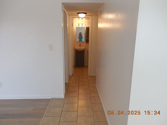 HALLWAY LEADING TO BEDROOM AND BATHROOM