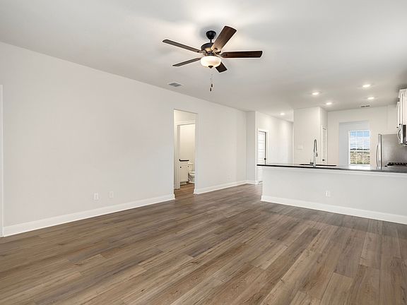 Open-concept layout with the kitchen overlooking the living room.