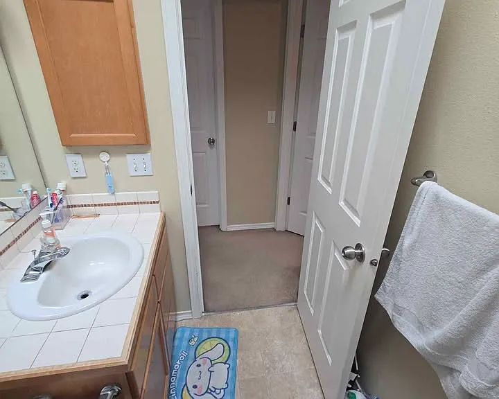 The bathroom you'll be sharing - that's the door to your room you can see to the left.