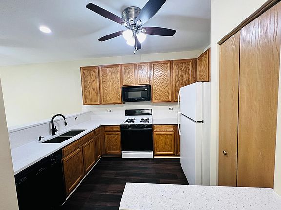Kitchen (new LVP flooring, new quartz countertops, new faucet, new stainless steel sink, new ceiling fan)