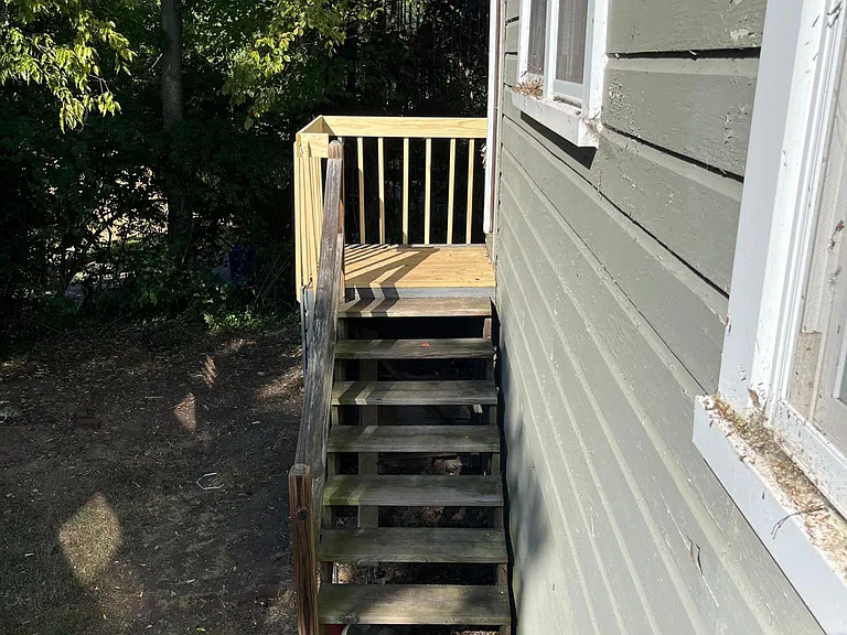 Stairs leading to back yard from kitchen