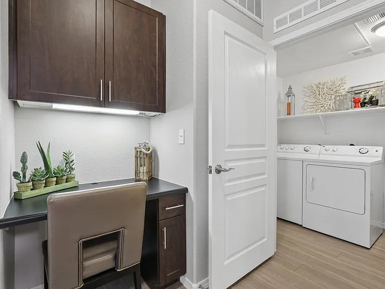 Welcome to Highland Groves at Morrison Ranch, where modern design meets convenience. This stylish laundry space features ample storage and sleek finishes, making chores a breeze. Explore your future home todayschedule a visit now!