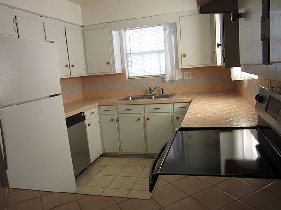 sitting at bar to kitchen