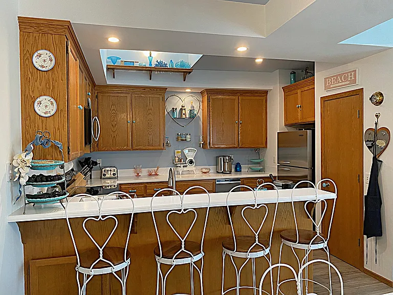 Charming Step-up Breakfast Bar w/Ice Cream Parlor Chairs reminiscent of a sweeter bygone era..