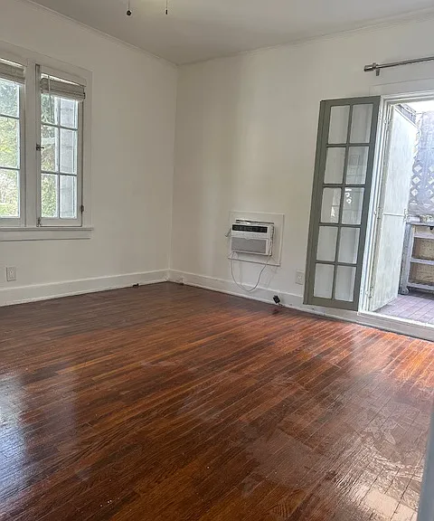 One bedroom with French doors to private yard