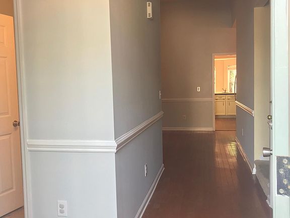 Light, bright entryway leads to large open plan living area.