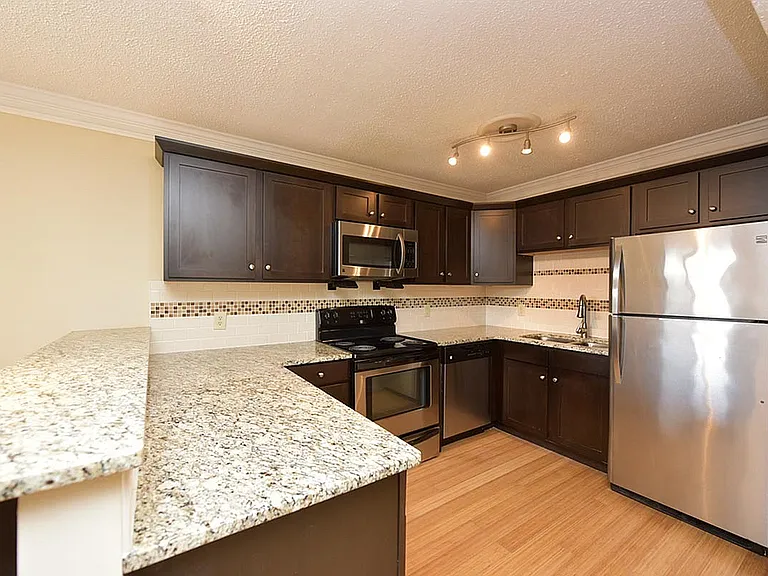 Experience culinary excellence in this sleek, modern kitchen designed for both style and functionality.