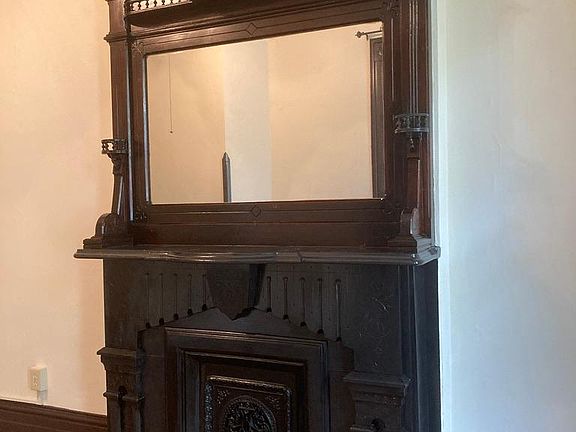 Original 1870s fireplace (non-operational) and mantle