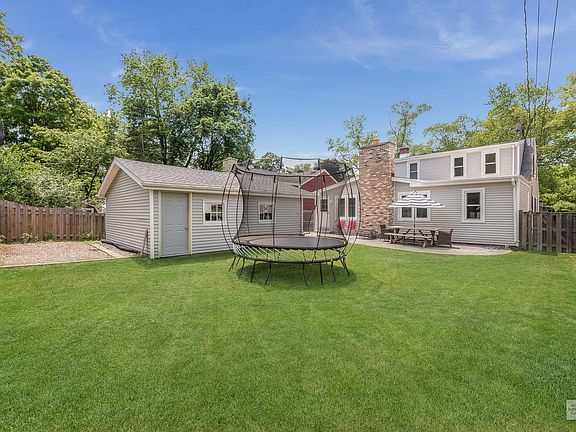 This fenced backyard provides lots of outdoor space for the entire family!