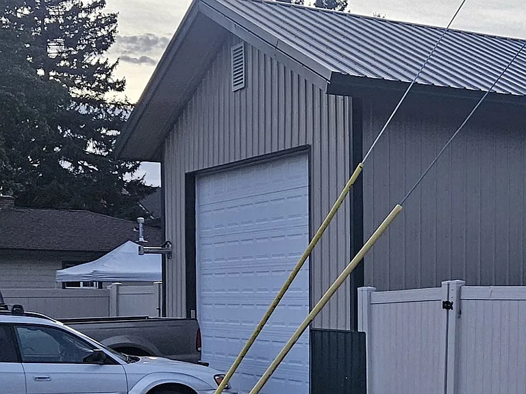 Front of 24'x30' shop with heater, automatic garage door, and loft area.
