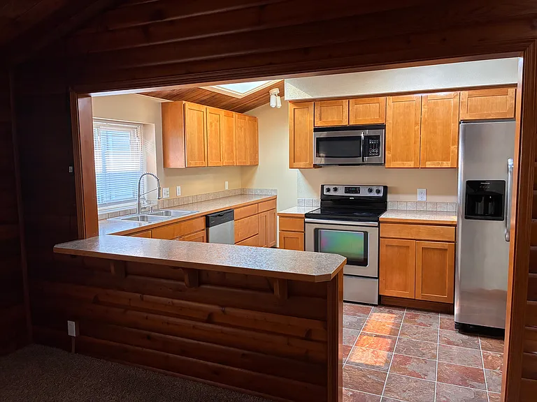 Kitchen with stainless steel appliances.