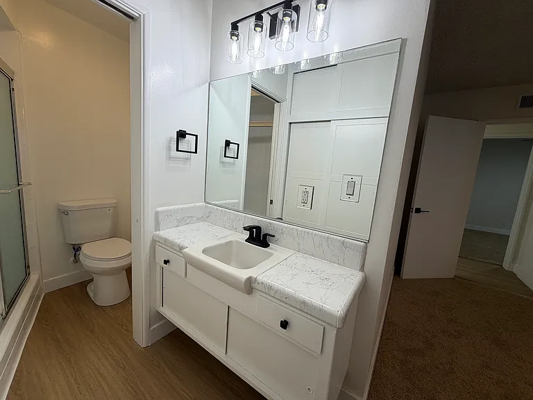 Primary Bathroom with Tiled Counter and Walk In Shower