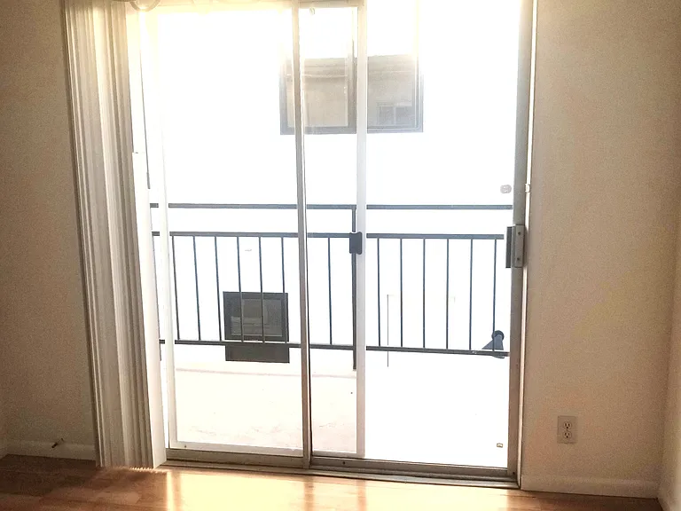 glass door to the right balcony from door entrance