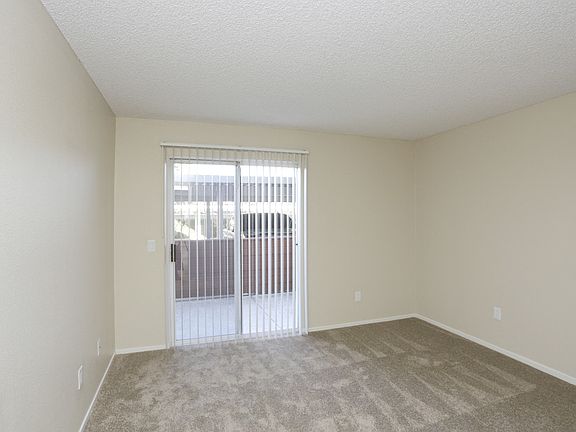 Downstairs bedroom sliding glass door to balcony