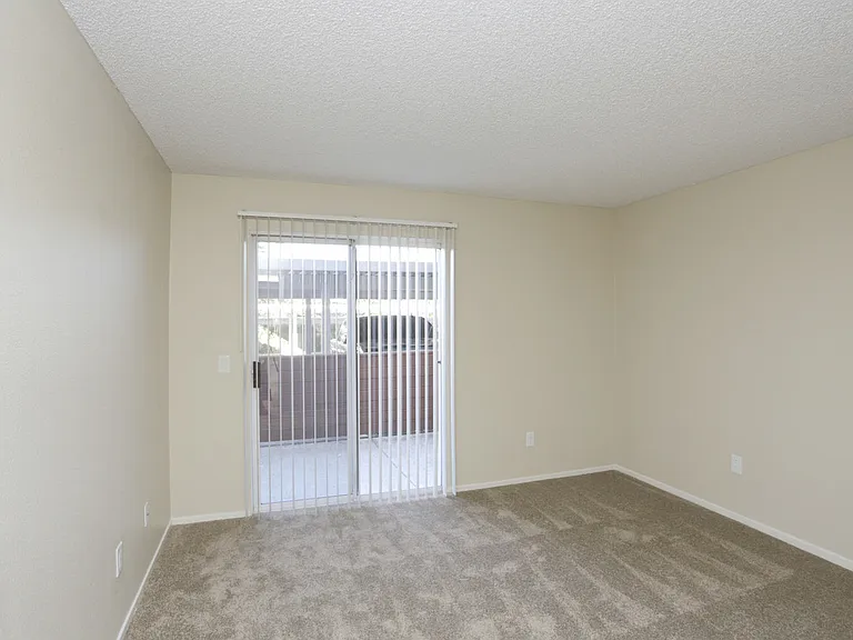 Downstairs bedroom sliding glass door to balcony