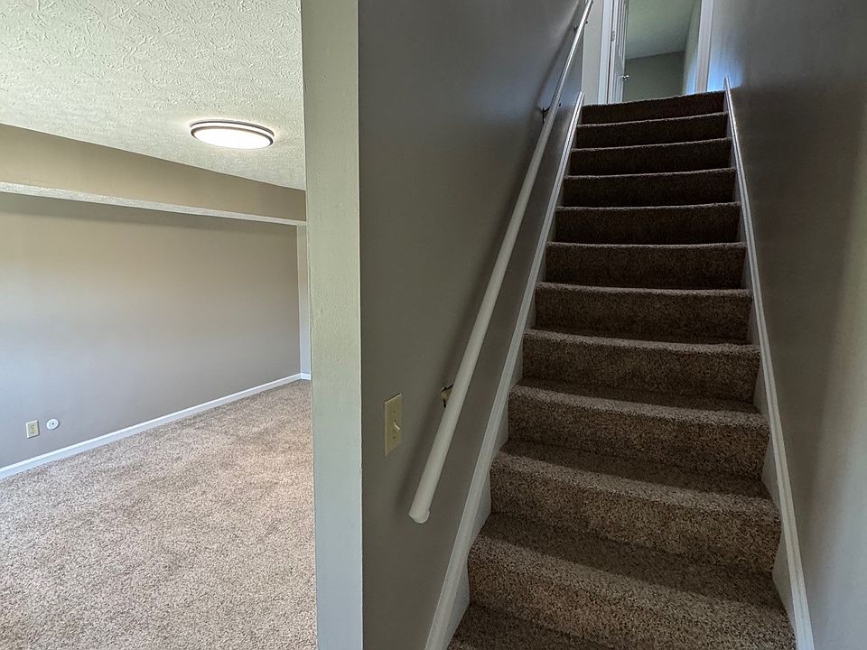 View of Stairs and Living room from Front Entry