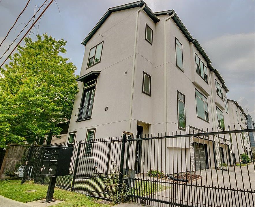 This townhome and neighboring townhomes are tucked behind an automatic security gate. This beautiful three story stucco townhome is located on the side of the complex and boasts windows that fill each room with abundant natural light.