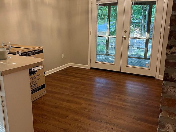 Dining Area at Back Door to Screened in Patio with View of Backyard .
