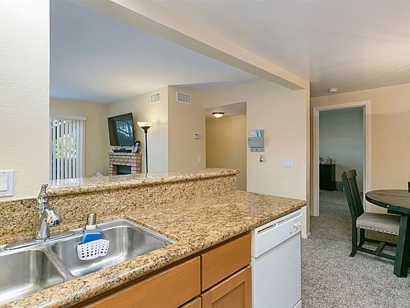 Here you can see the open floor plan of the kitchen, living room, and dining room.
