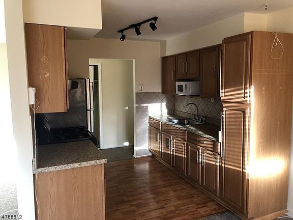 Bright and sunny freshly painted condo with updated kitchen, and bathrooms, close to public transportation to NY City and shopping, swimming pool, BBQ and Laundry on premises.