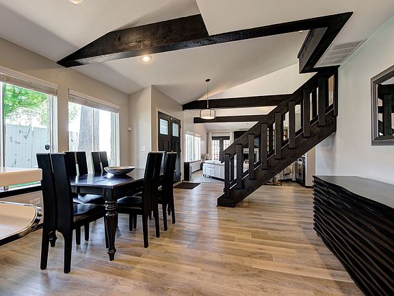 FULLY FURNISHED RENTAL: Dining table expands to seat 8 comfortably with views of 60" television