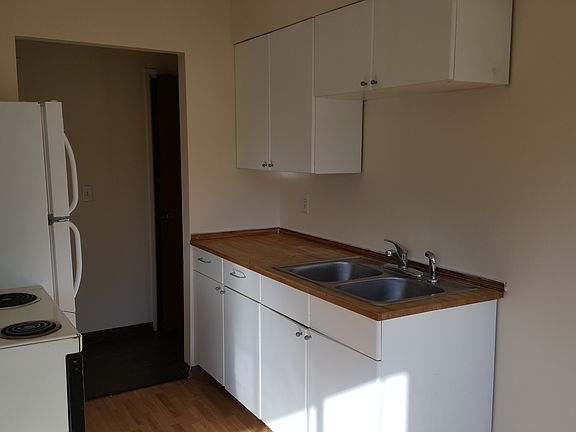 Galley style kitchen with eat-in area