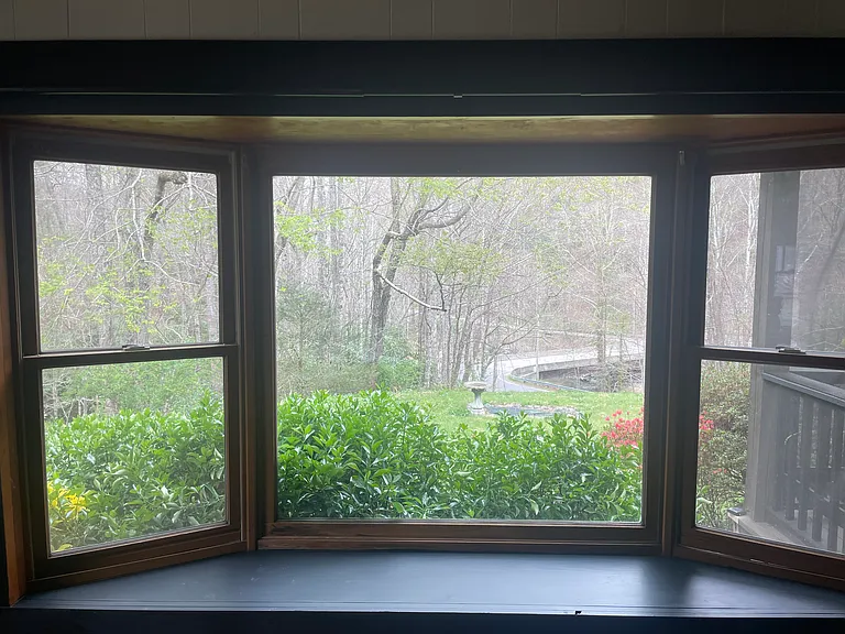 The bay window in the kitchen overlooks the Rocky Broad River